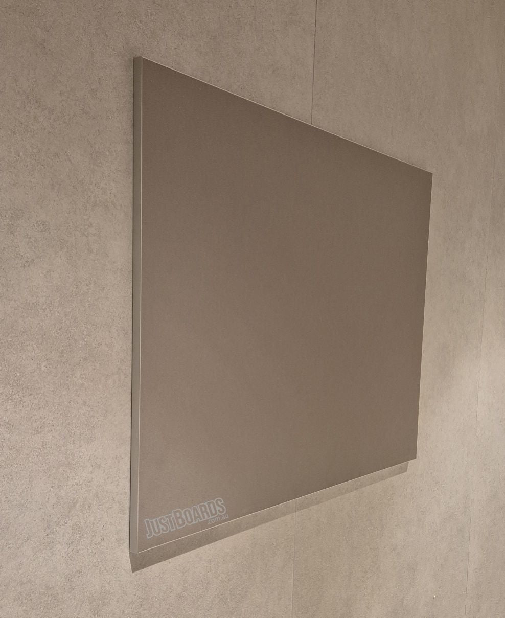 Frameless Krommenie pinboard in taupe on a rendered wall