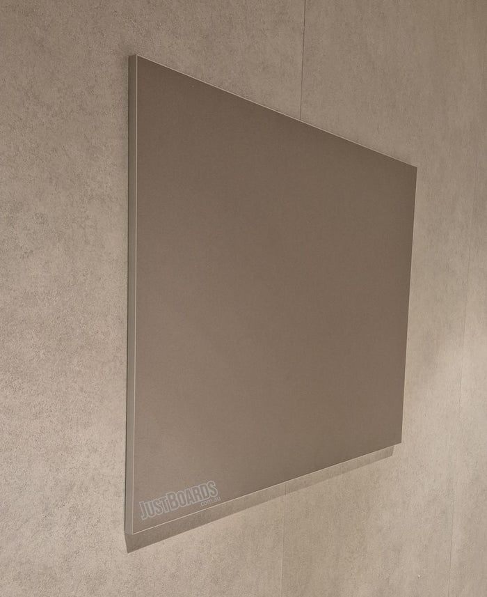 Frameless Krommenie pinboard in taupe on a rendered wall