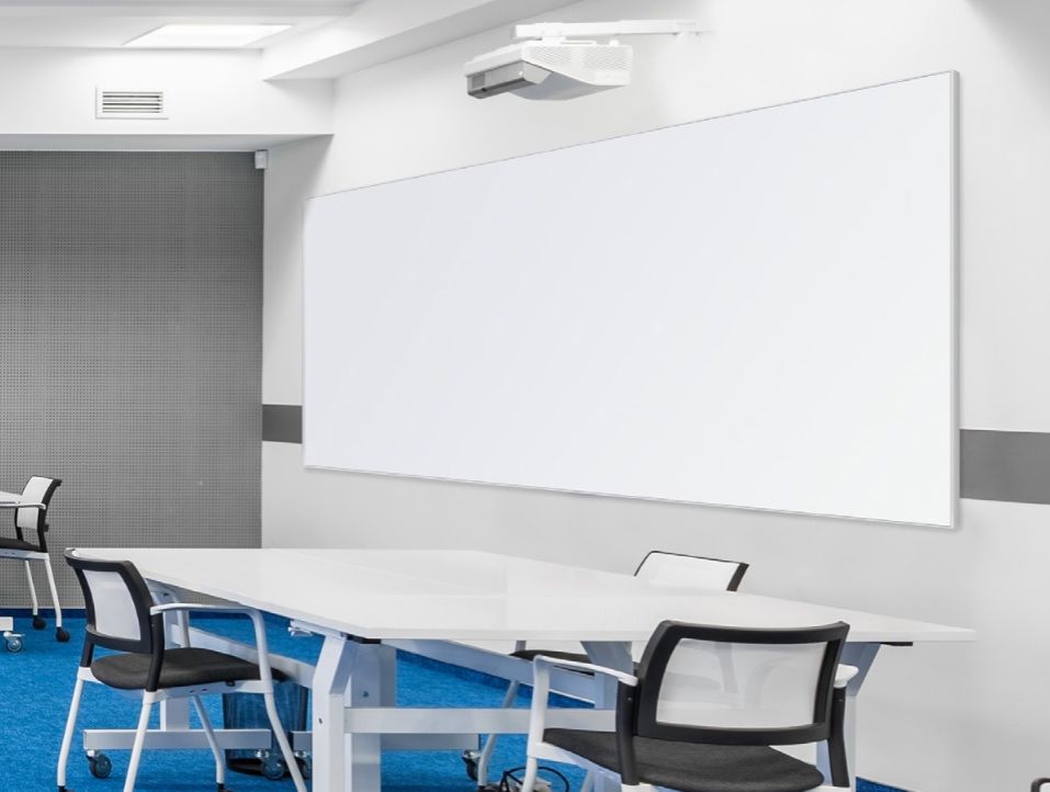 Porcelain projection whiteboard with short throw projector in a classroom