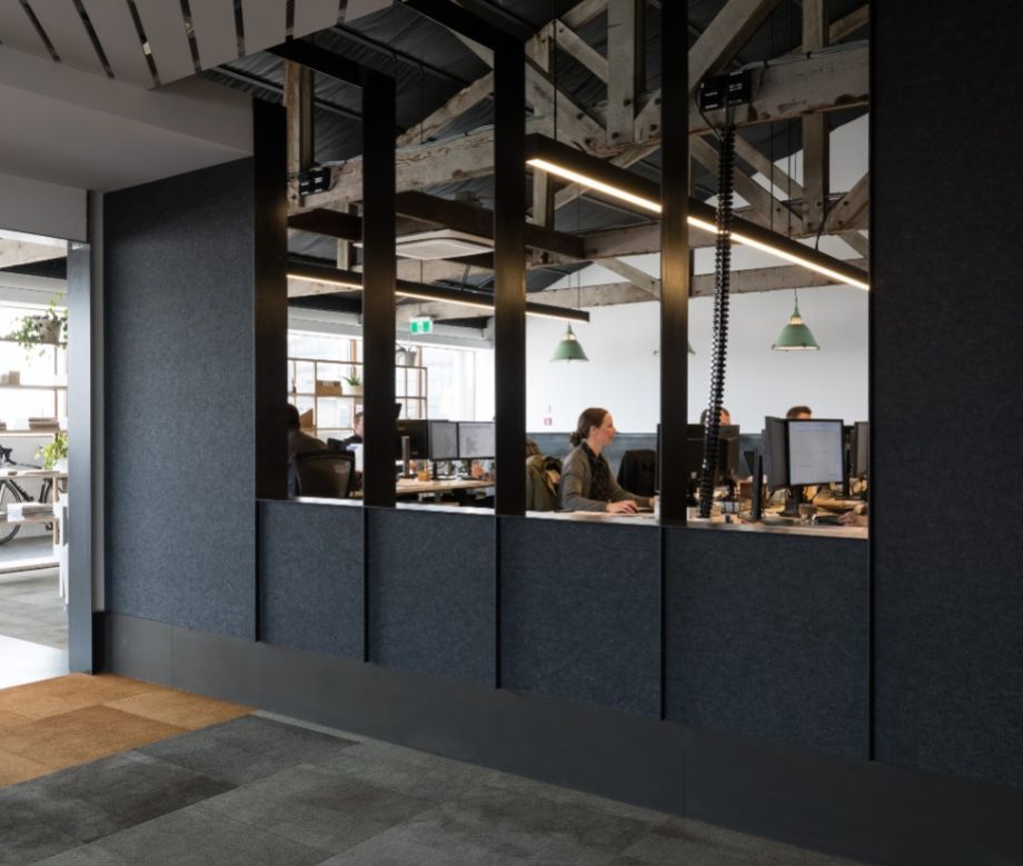 Autex Cube acoustic panels lining a dark open plan office fit out